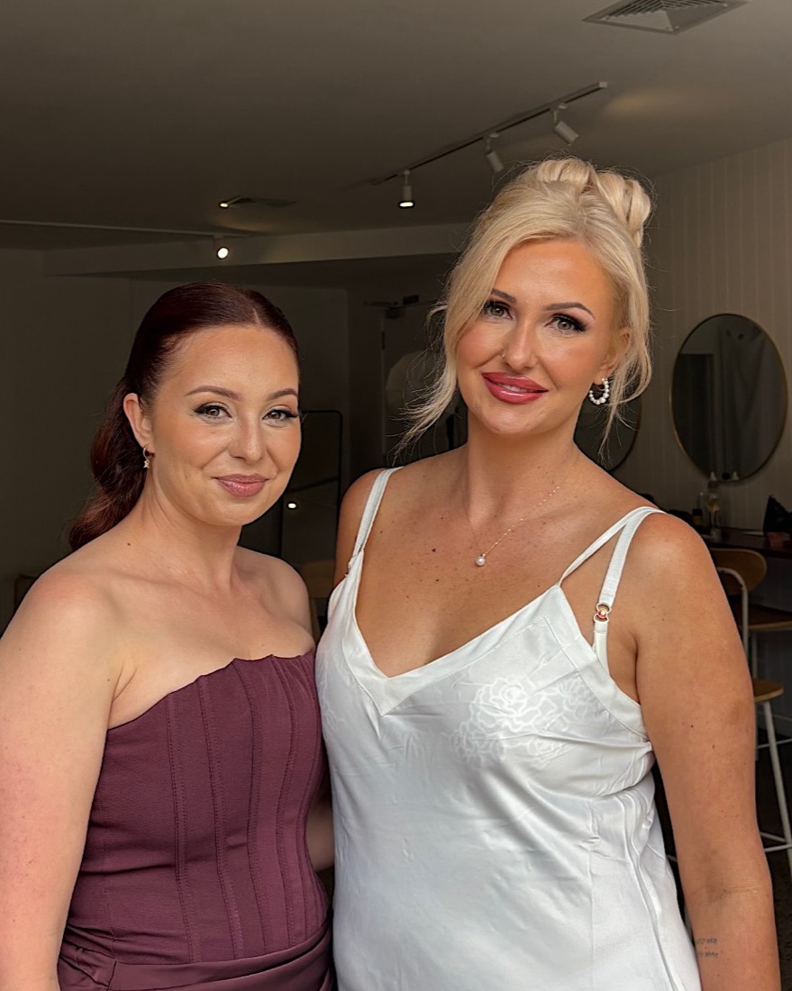 Bride and bridesmaid with soft, glowing wedding makeup