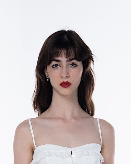 Editorial red lip with defined lashes and a fringe